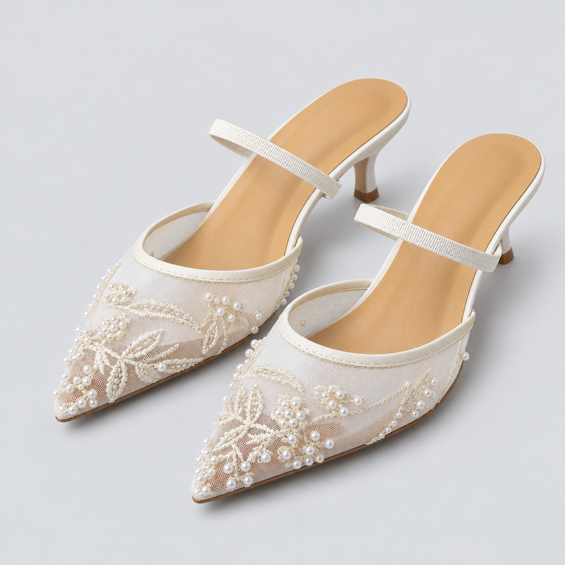 White embroidered mesh kitten heel slingbacks — studio view with pearl and woven strap details