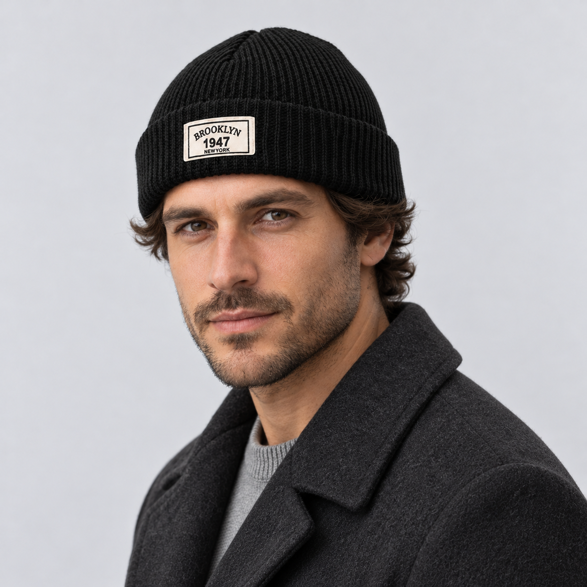 Montarello Men’s Hat Beanie Short Fisherman Cuffed Knit — Black — angled view worn by model