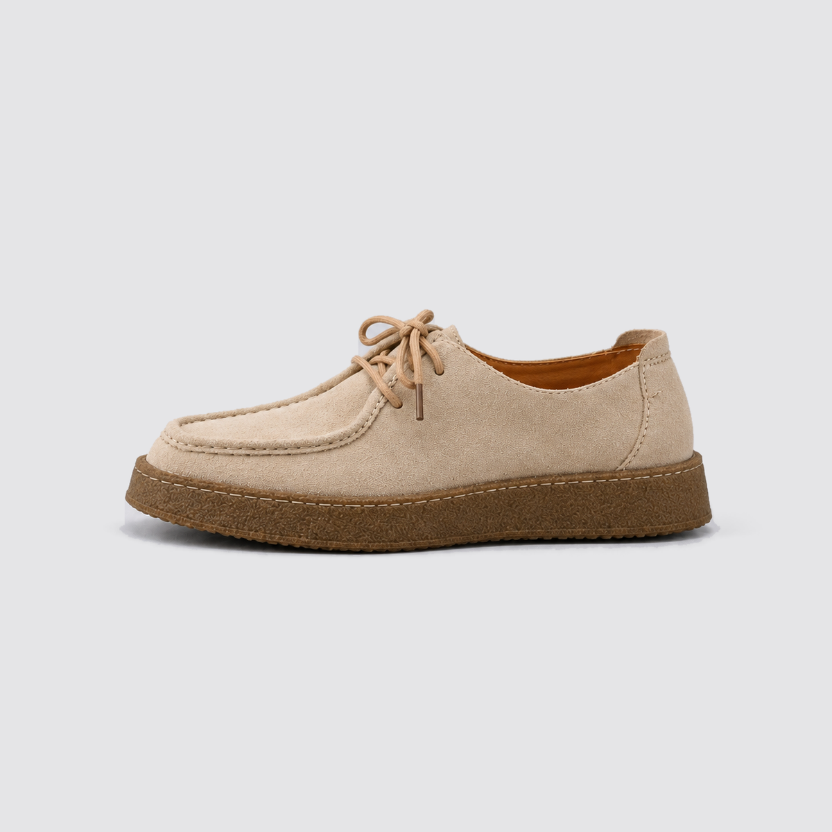 Beige shoe, side view, background #e5e5e7